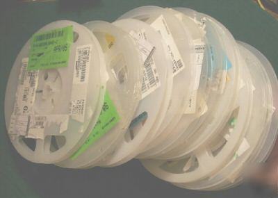 11 partial reels capacitors & resistors, estimated 5K+